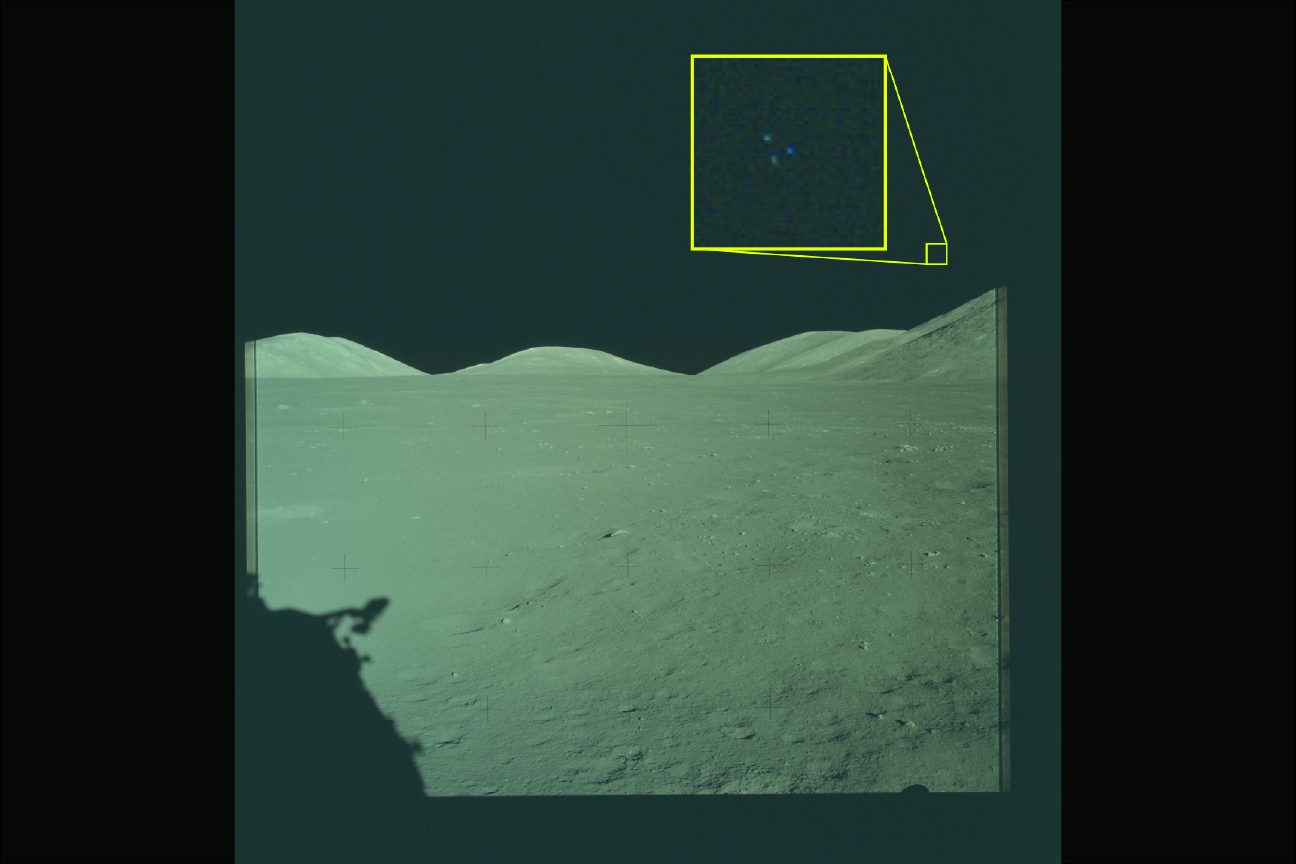 Apollo 17 mission archival photograph showing three lights in triangular formation in the lower right quadrant of the lunar sky, December 1972. Released May 8, 2026 by the U.S. Department of War as part of the PURSUE program; under active U.S. government reanalysis using the original mission film.